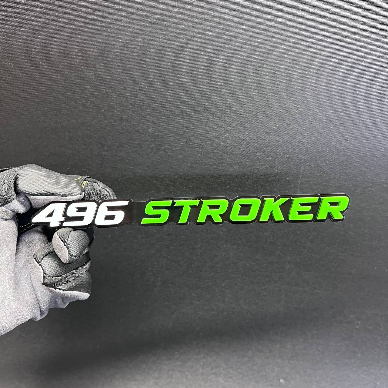 496 Stroker car badge fender emblem with green and white lettering on a black base
