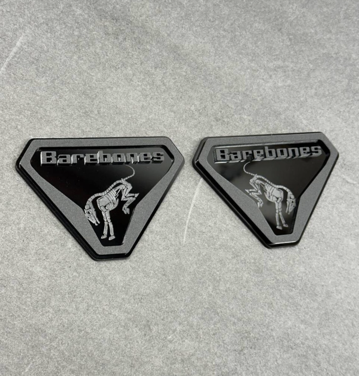 Angled view of Barebones skeleton badge installed on Ford Bronco exterior panel