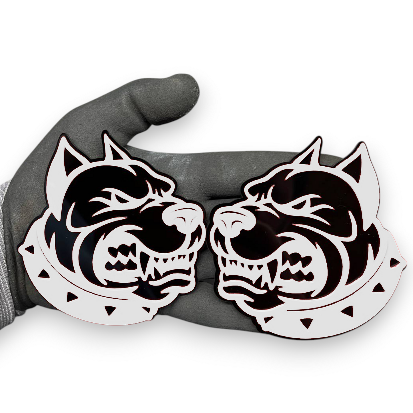 Dog head badge pair shown as custom vehicle fender emblem with aggressive design