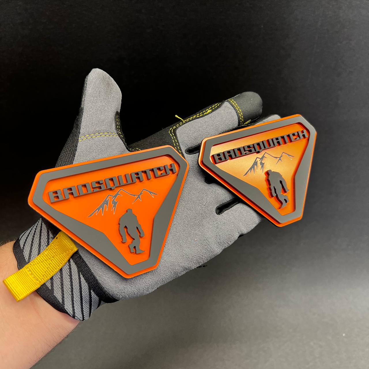 Custom orange gray BadSquatch tailgate badge for trucks