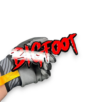 Aggressive BIGFOOT text car badge with black outline and sharp dripping lettering design