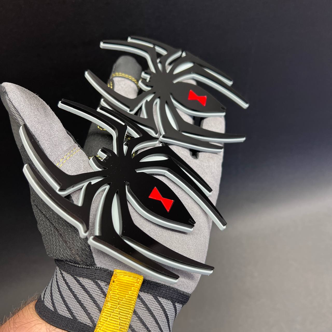 Custom automotive Black Widow spider emblem with layered 3D appearance and contrasting outline