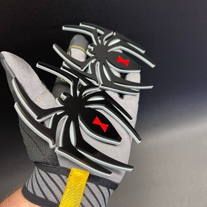 Custom automotive Black Widow spider emblem with layered 3D appearance and contrasting outline