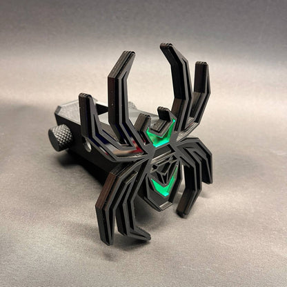 Matte black spider hitch cover with poison green illuminated-style accents for truck receivers.