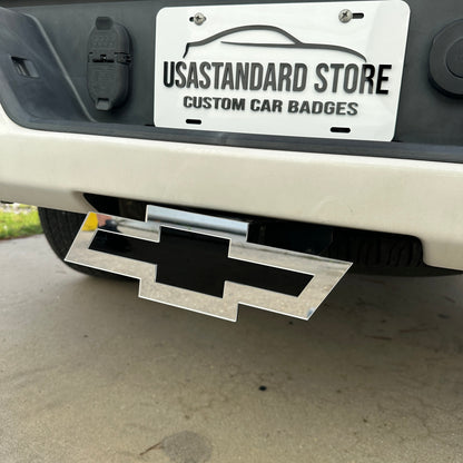 Chevrolet receiver hitch cover with silver border and black Bowtie center
