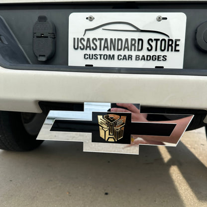 Chevy Bowtie hitch cover in silver with gold robot emblem and black center