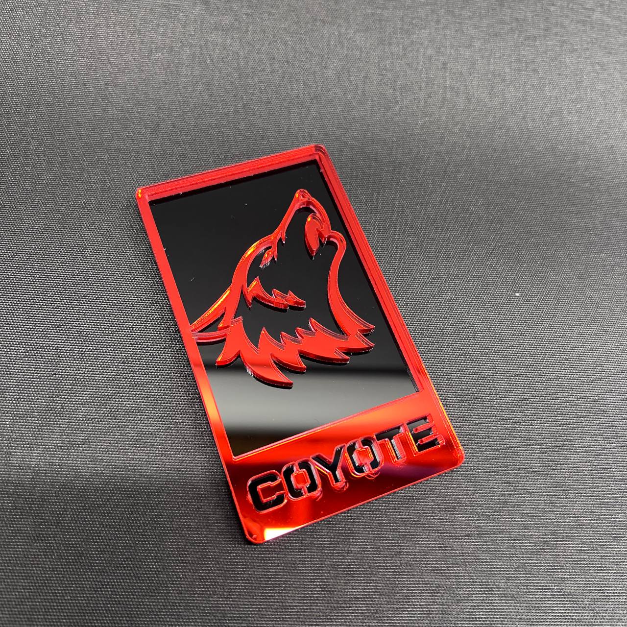 Handmade Coyote 5.0 front grille badge with red wolf style design