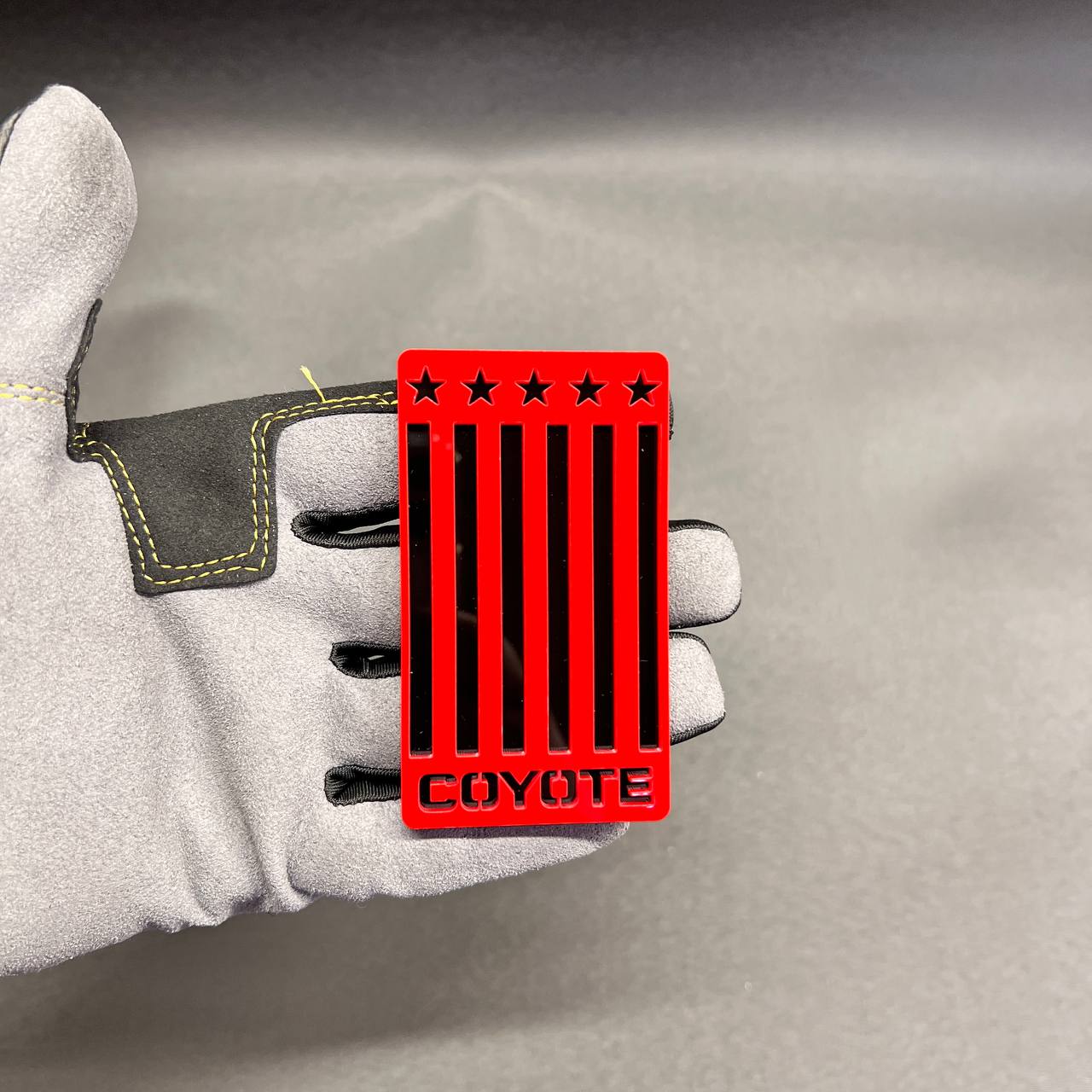 Red and black acrylic Coyote flag Car Badge Fender Emblem for Ford Mustang GT performance styling.