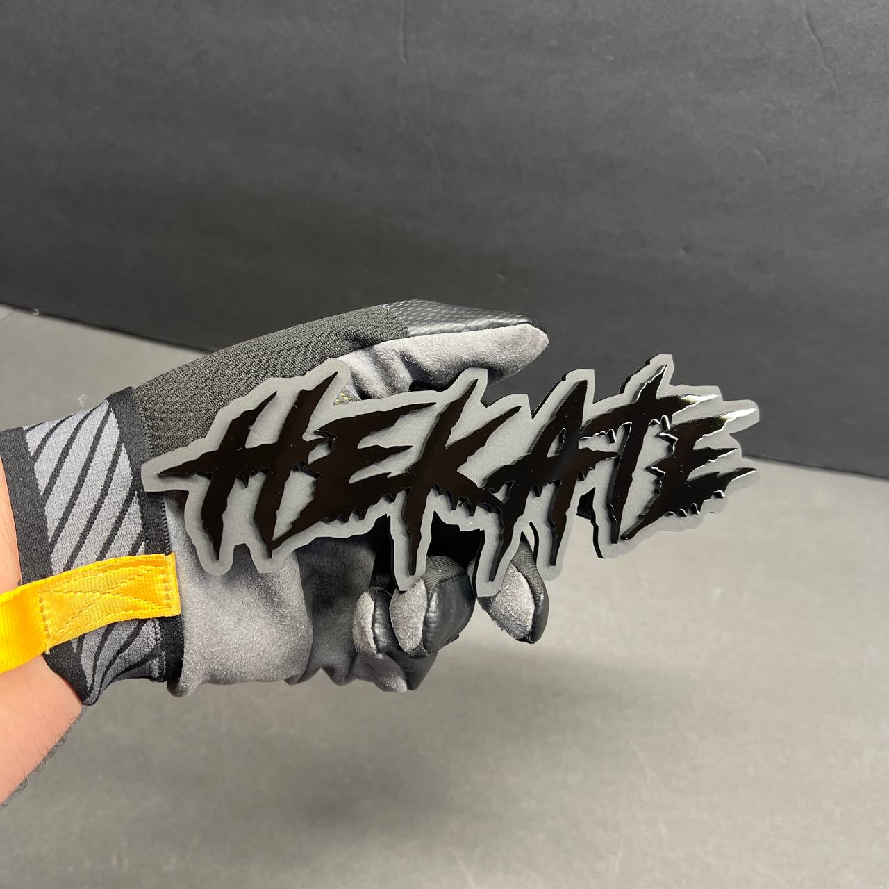 Aggressive dripping font acrylic badge with black and red finish