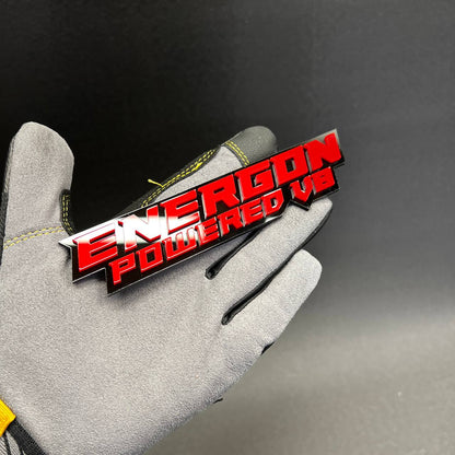 Handmade acrylic V8 performance badge with red top layer and black shadow backing.