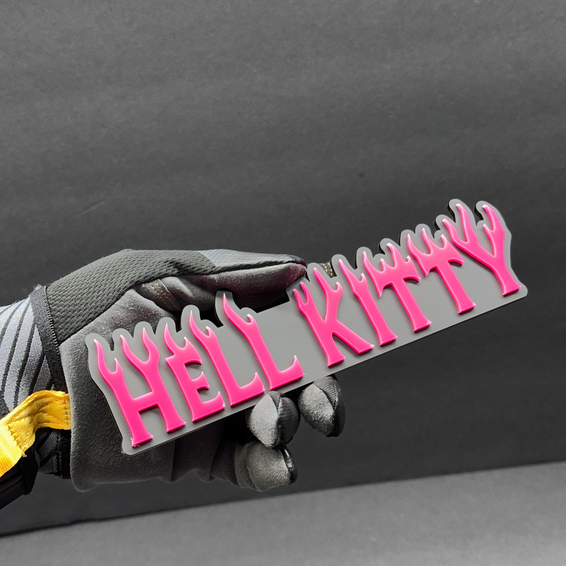 Glossy black and pink Hell Kitty custom text badge for Silverado tailgate