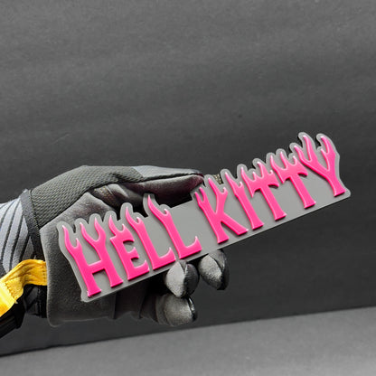 Glossy black and pink Hell Kitty custom text badge for Silverado tailgate