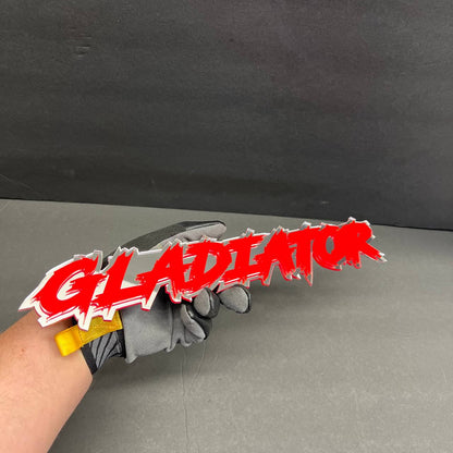 Red and white GLADIATOR acrylic text badge for Jeep Gladiator fender styling.