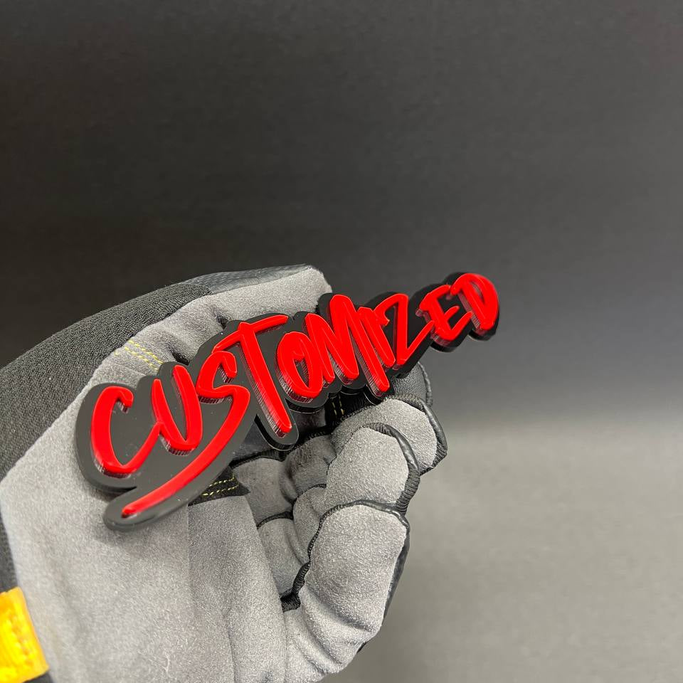 Red custom badge with black outline in graffiti font
