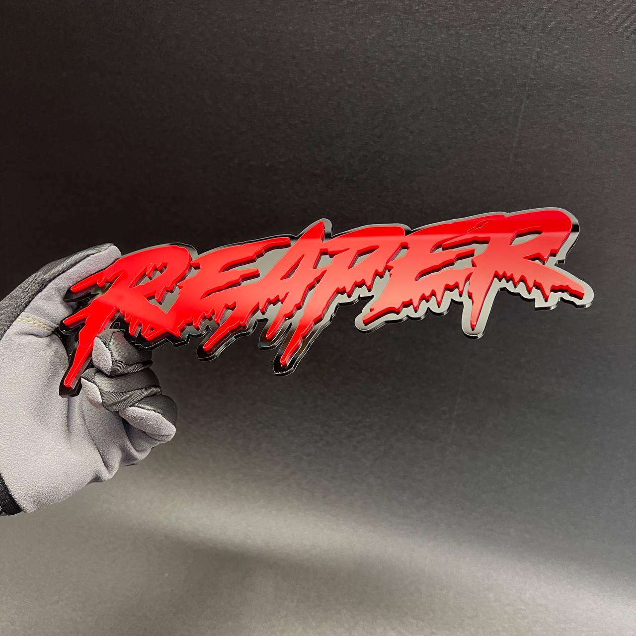 custom aggressive text emblem on GMC Sierra truck tailgate