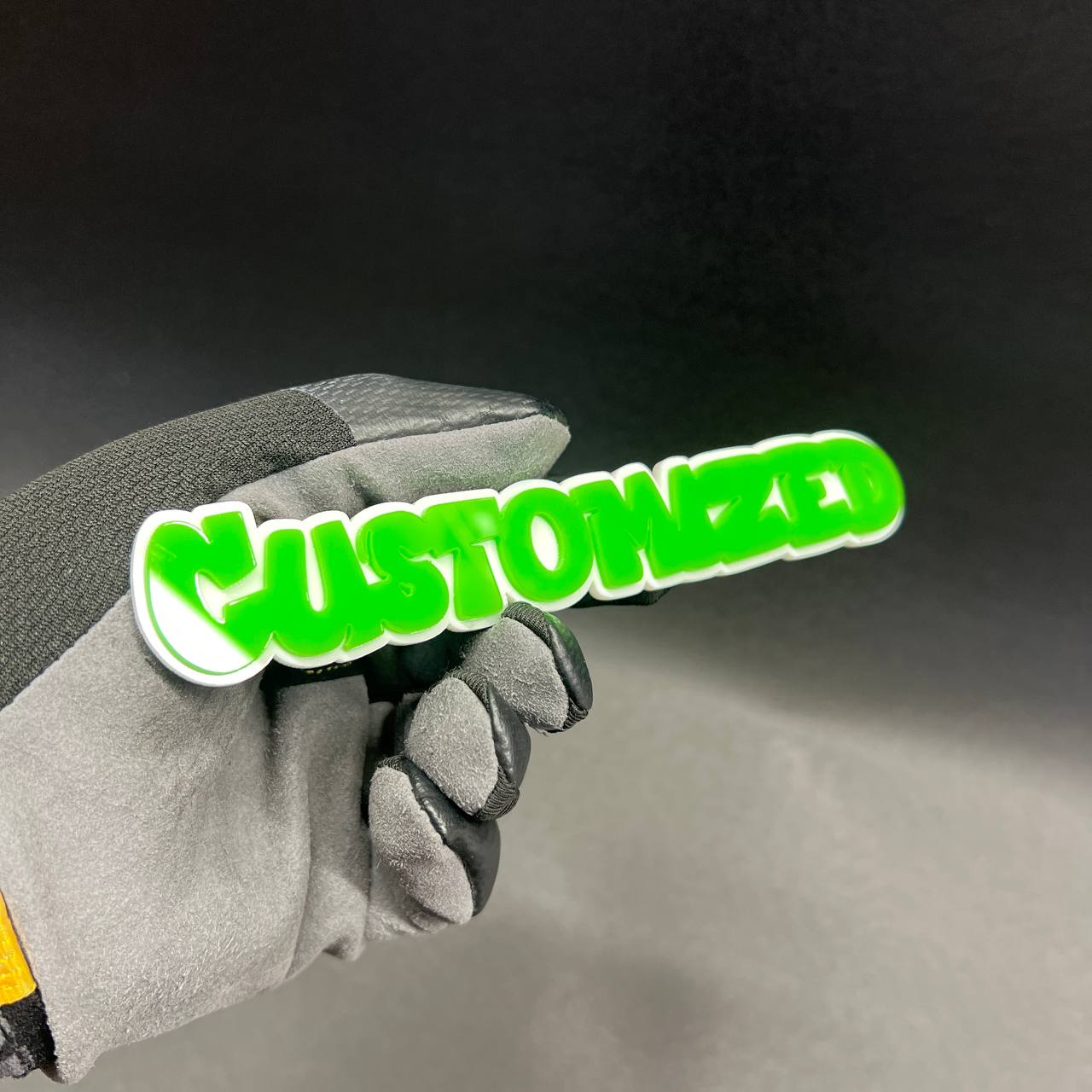 Green and white custom text emblem for automotive exterior styling