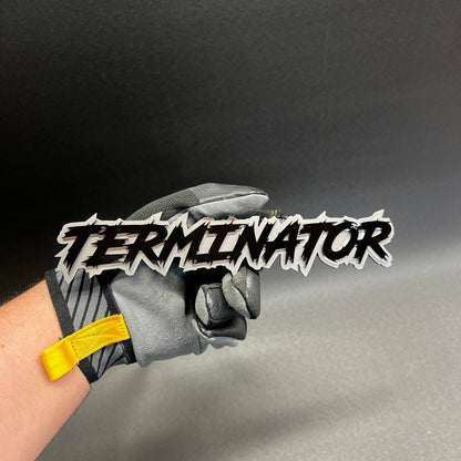 Performance inspired TERMINATOR text badge mounted on vehicle exterior with sharp edge lettering