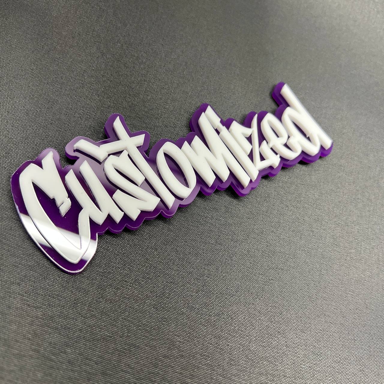 Purple and white custom name car emblem with glossy finish