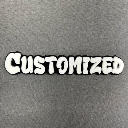 Custom graffiti font car badge in white letters with black outline