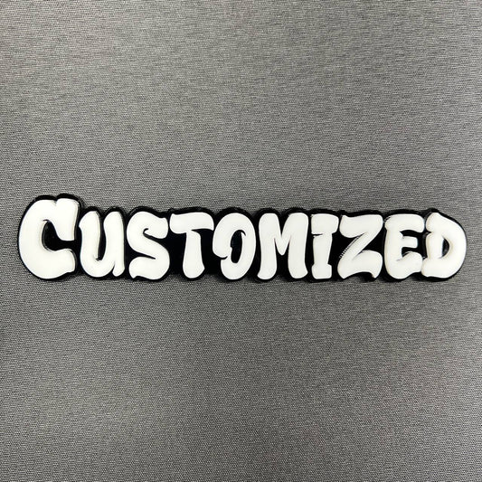 Custom graffiti font car badge in white letters with black outline