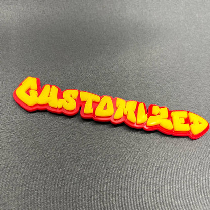 Graffiti style car emblem with personalized name lettering.