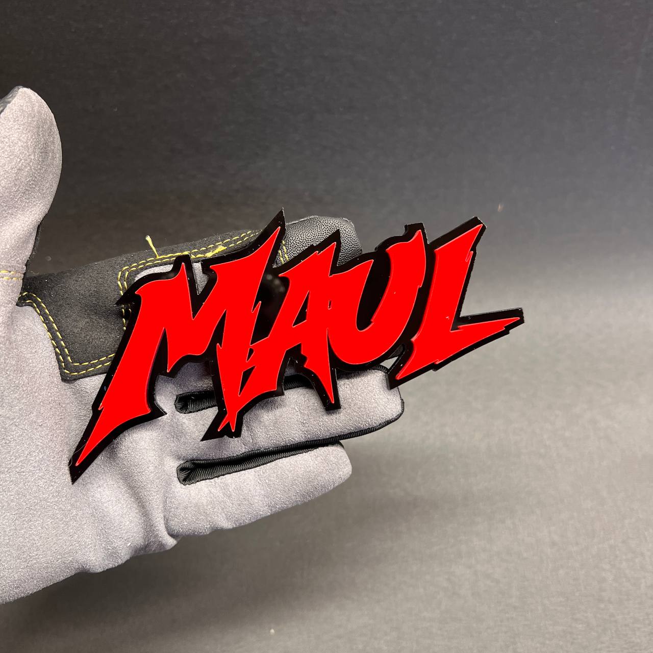 Red and black MAUL tailgate badge for cars and trucks