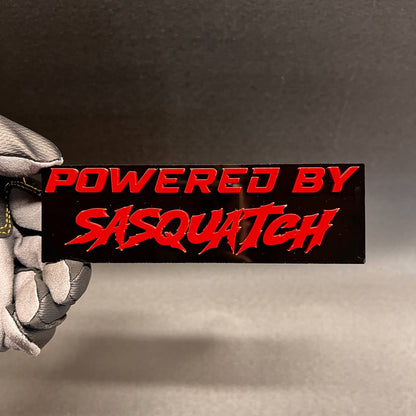 Red black Sasquatch text badge with 3D layered automotive style