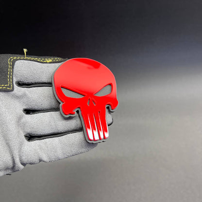 Punisher style skull vehicle badge shown in red on black background