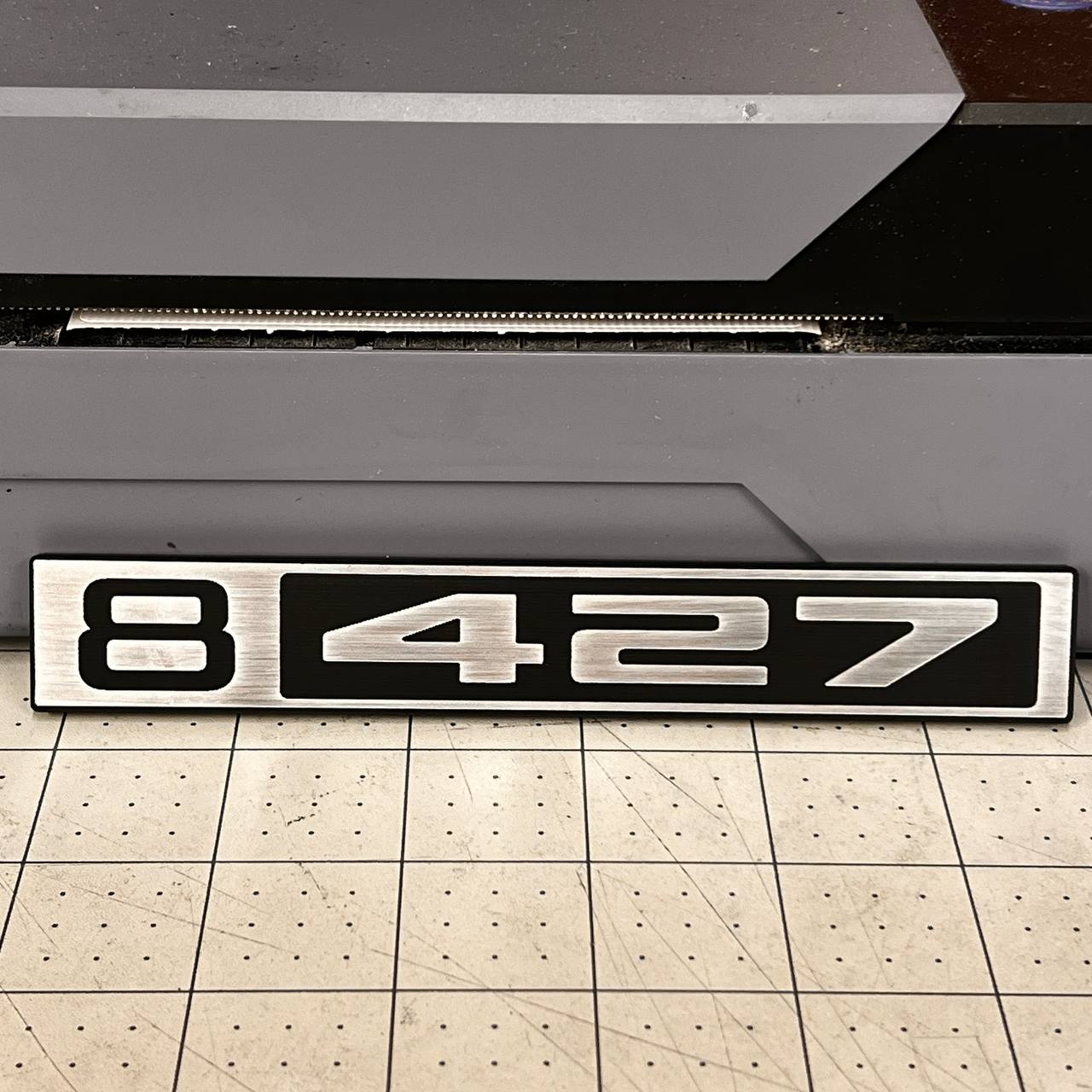 Silver and black Chevy C10 B 427 custom front emblem for classic 1967-1972 trucks.
