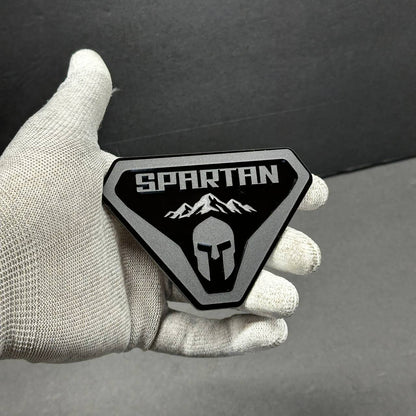 Close-up detail of custom Spartan fender-helmet badge for Ford Bronco off-road truck