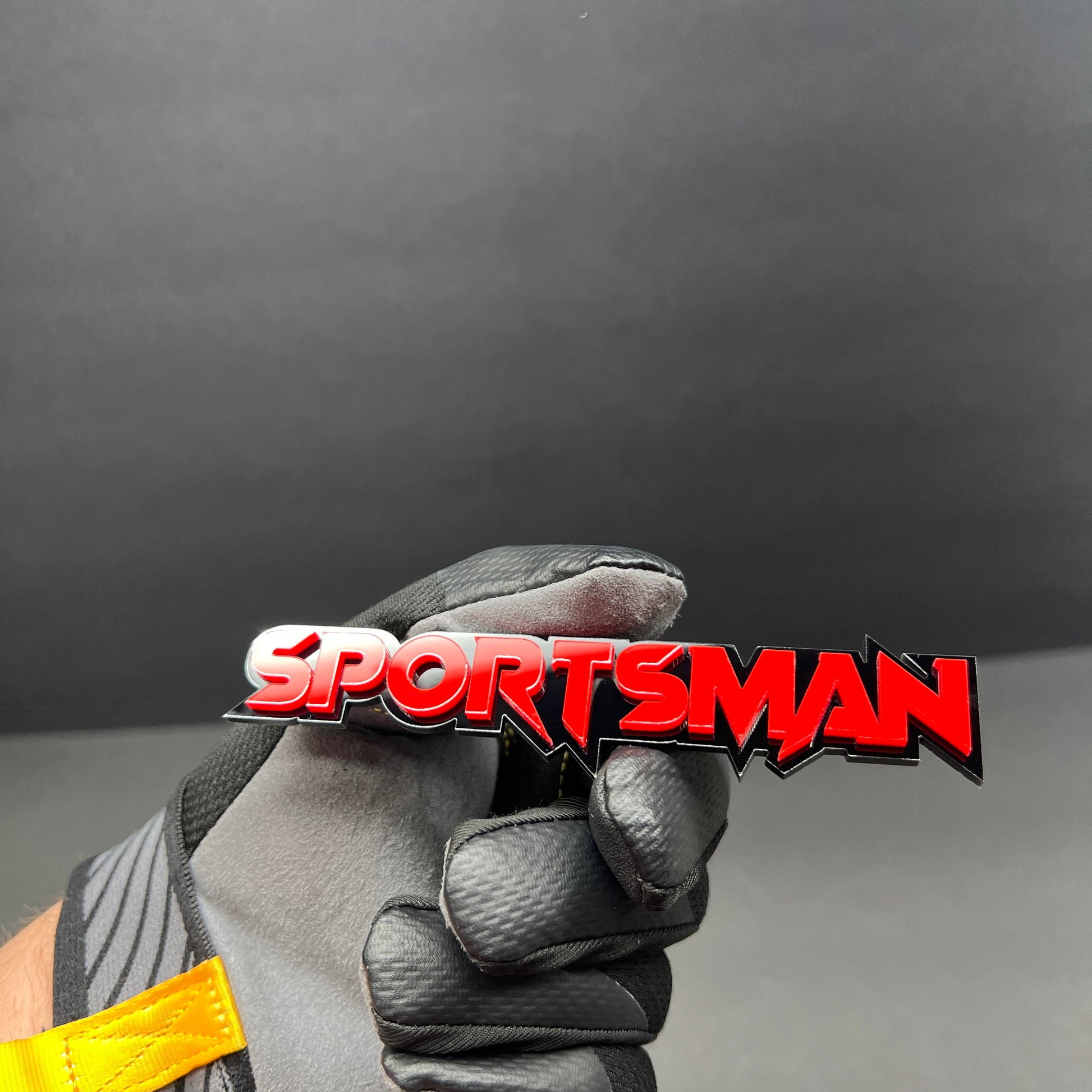 Custom SPORTS MAN text badge with layered acrylic design for automotive tailgate and hood applications