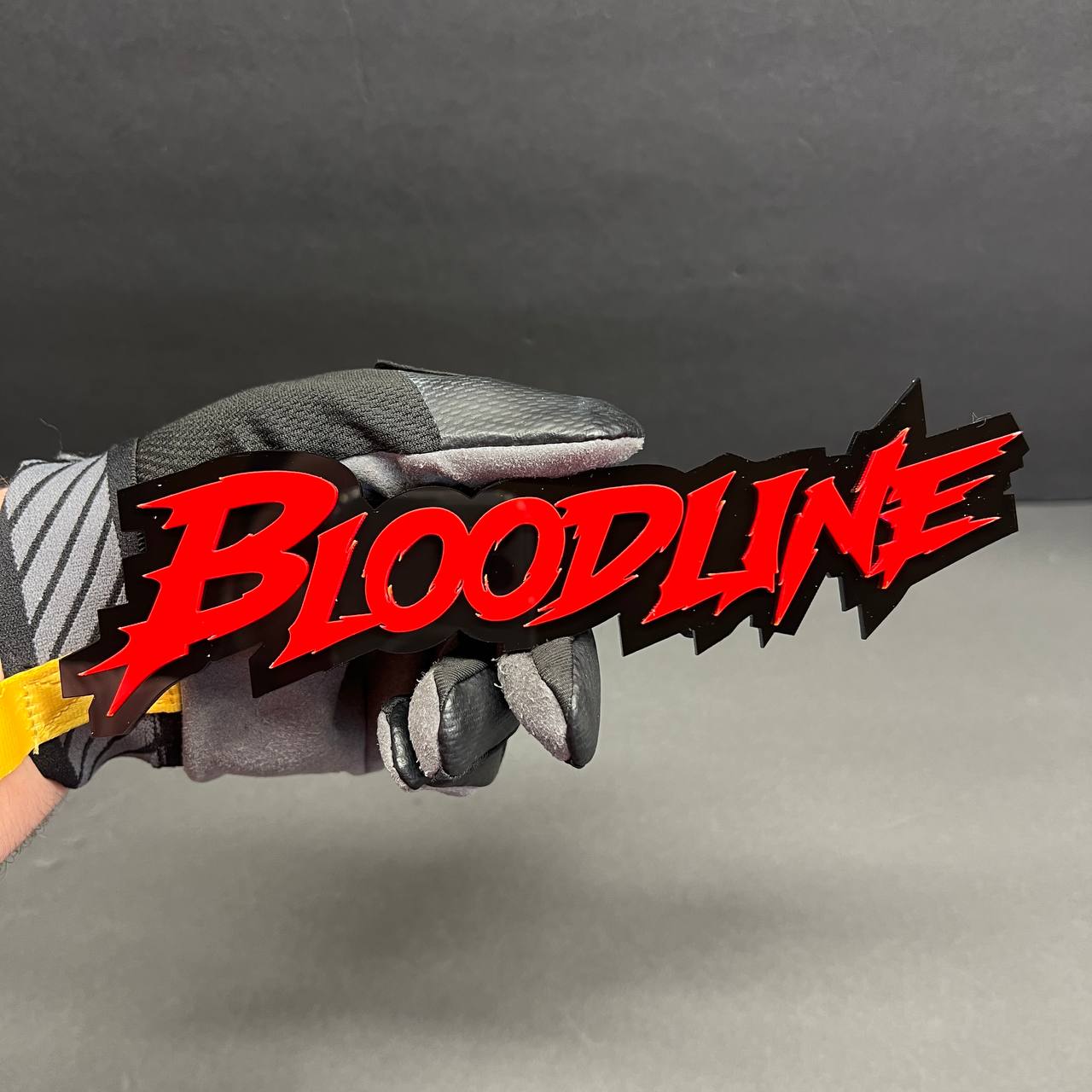 acrylic sharp font badge red black high contrast detail