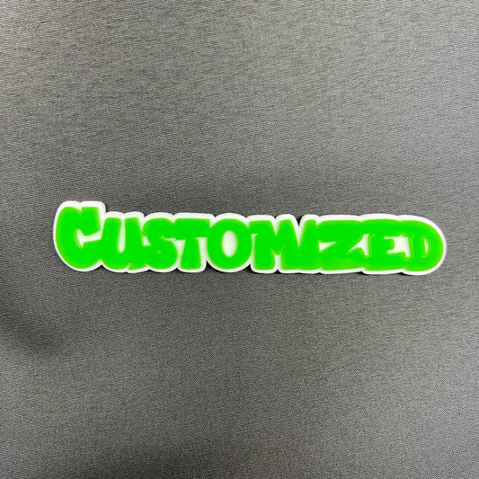 Custom green text car badge with white outline for exterior vehicle decoration