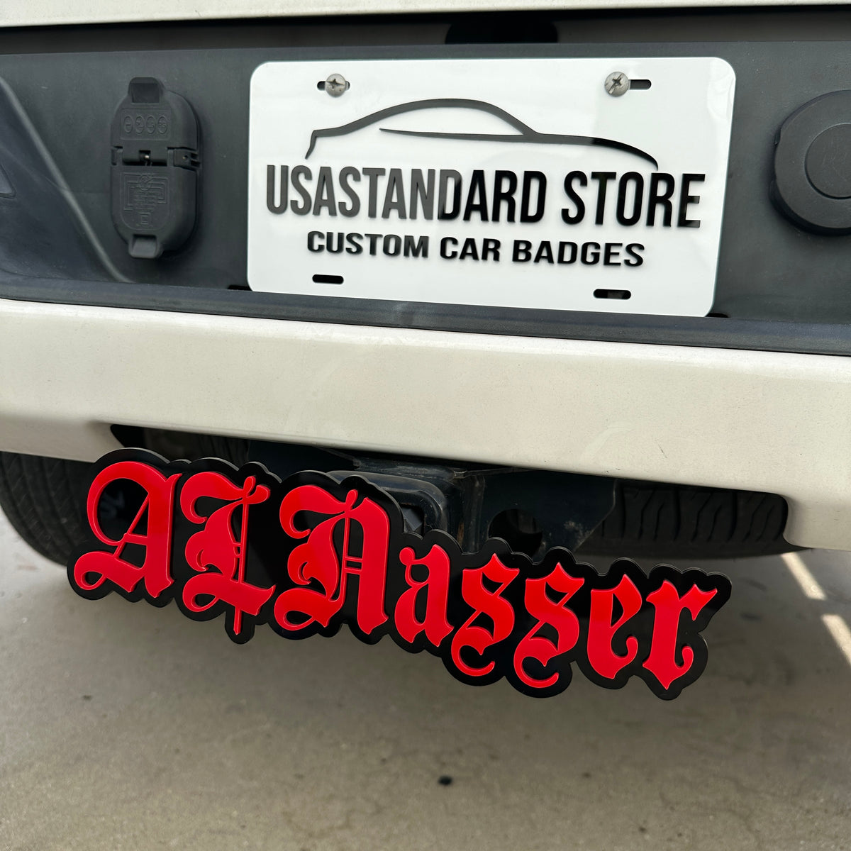 Custom name hitch cover in red and black for truck receiver