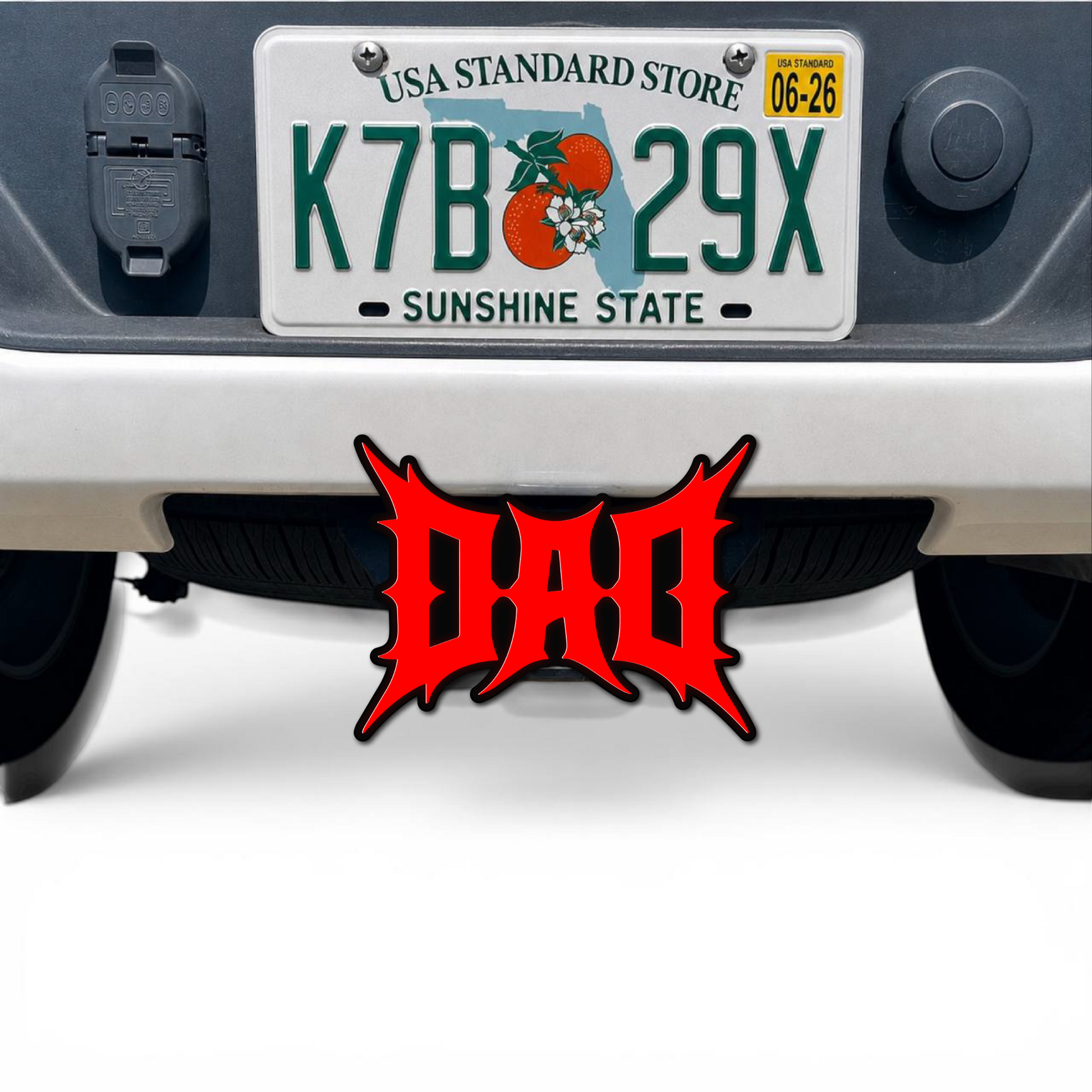 3D DAD hitch cover car badge in red and black mounted below truck license plate