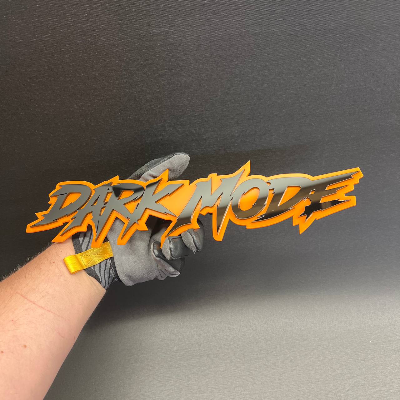 DARK MODE custom truck badge with black gloss lettering and orange outline