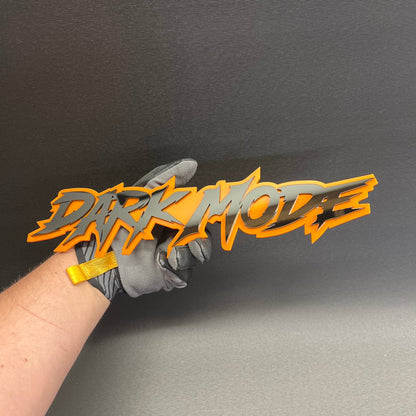 DARK MODE custom truck badge with black gloss lettering and orange outline