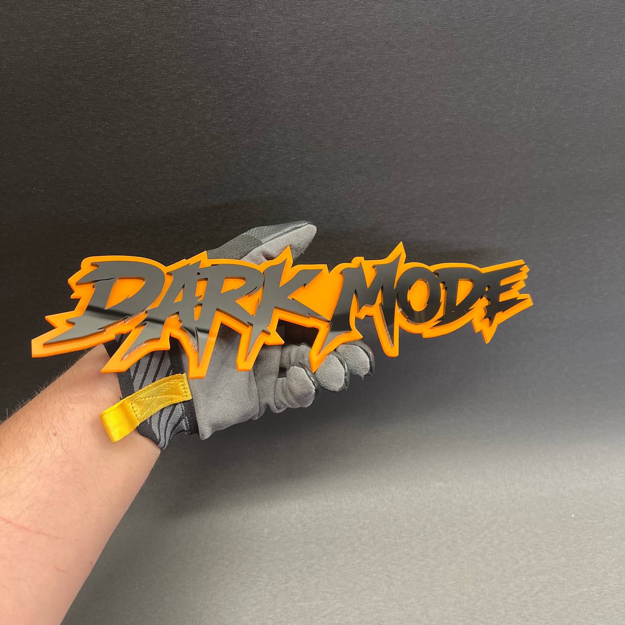 DARK MODE tailgate badge with sharp graffiti lettering style