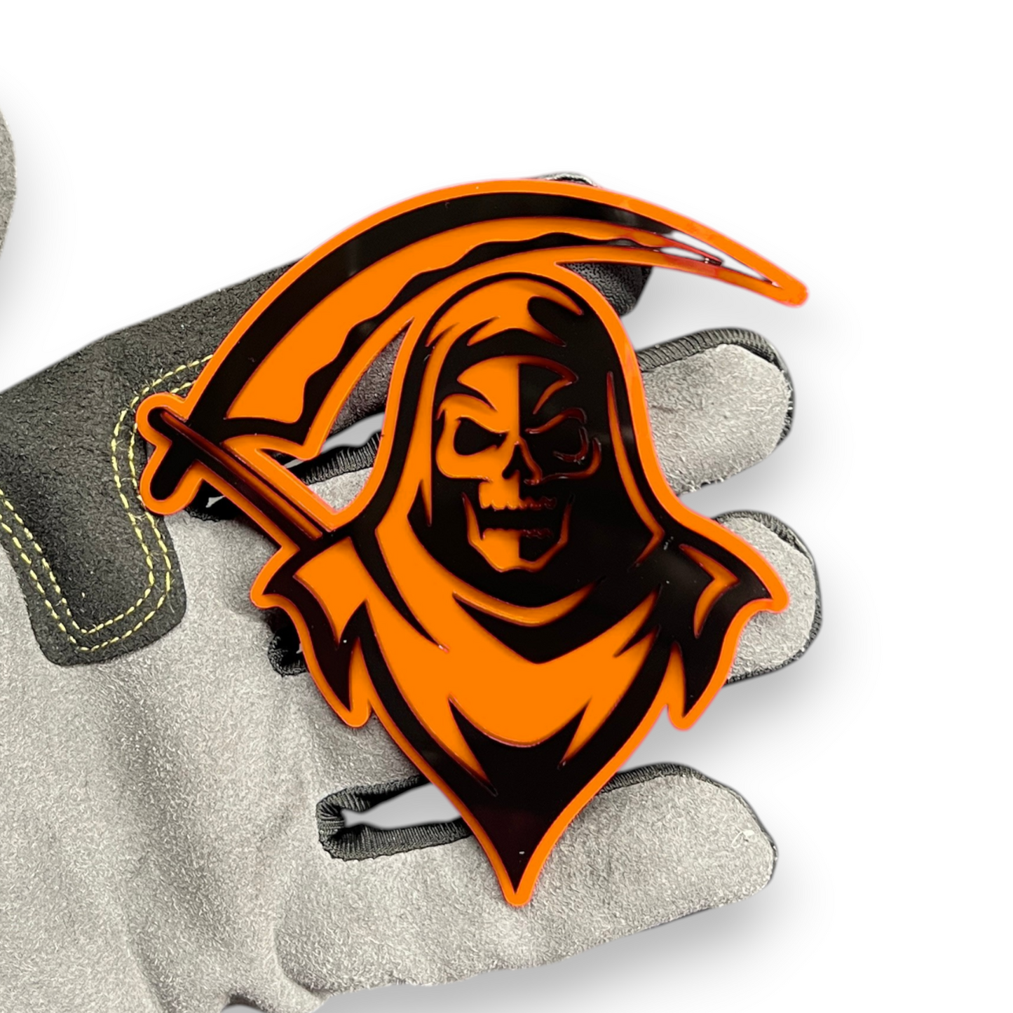 Reaper badge shown as custom vehicle fender emblem with hooded skull design