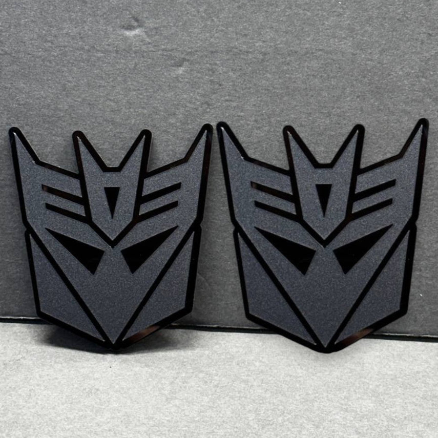 Pair of Decepticon car emblems – matte black acrylic Transformers badges 2PC set.