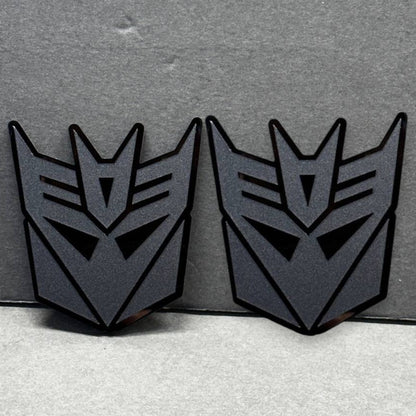 Pair of Decepticon car emblems – matte black acrylic Transformers badges 2PC set.