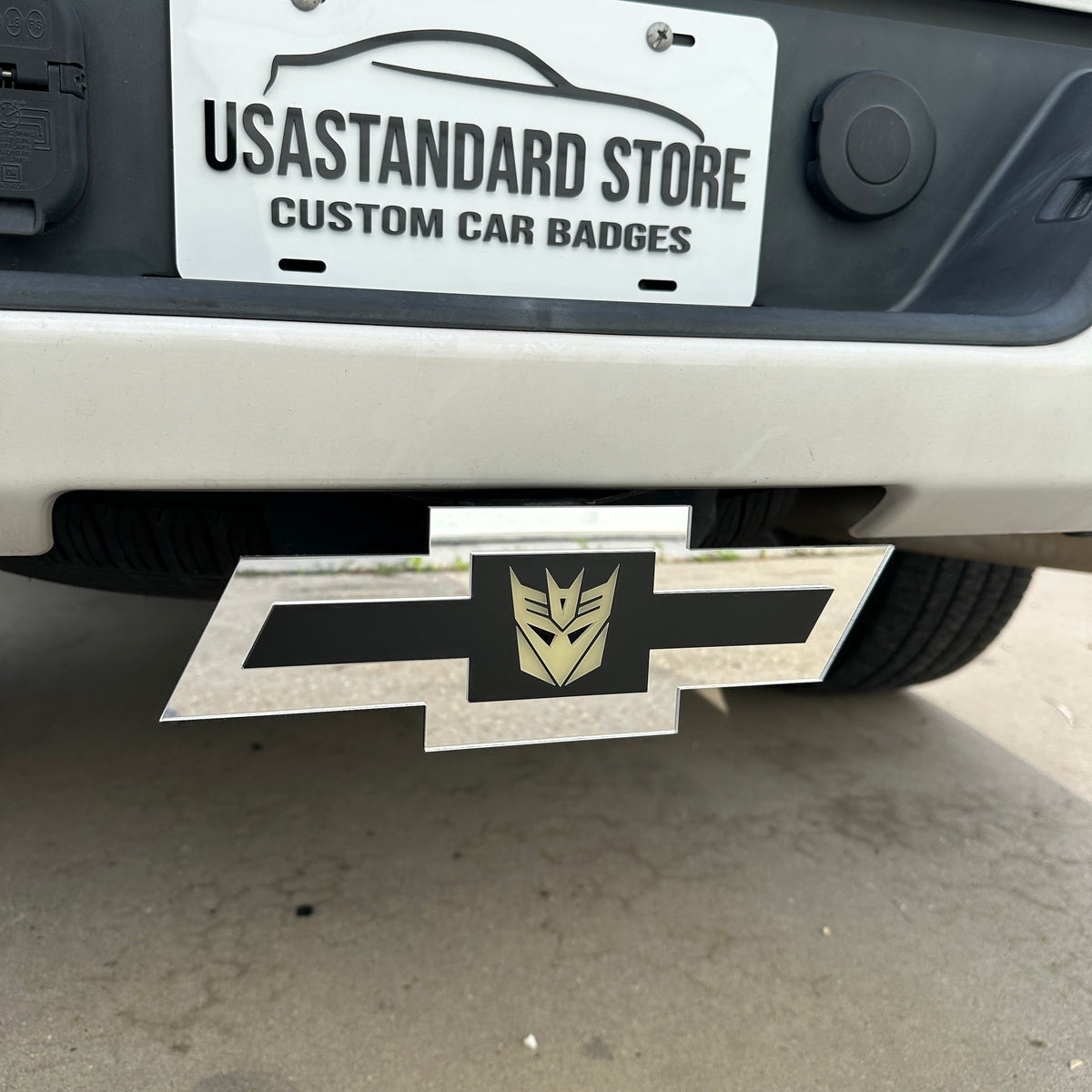 Chevy Bowtie trailer hitch cover with glow in the dark Decepticon emblem