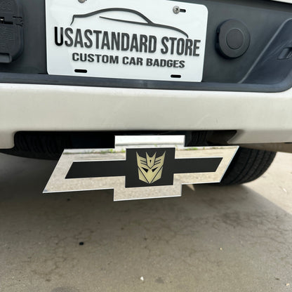 Chevy Bowtie trailer hitch cover with glow in the dark Decepticon emblem