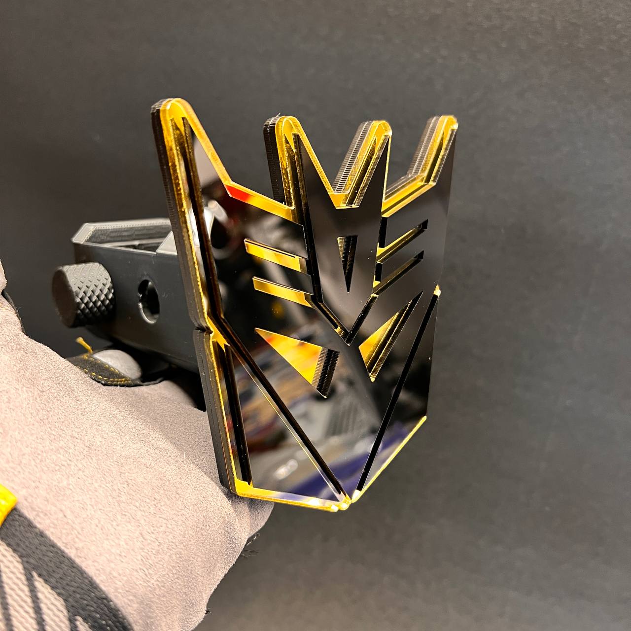 Premium black gold Decepticon style hitch receiver cover for vehicle exterior