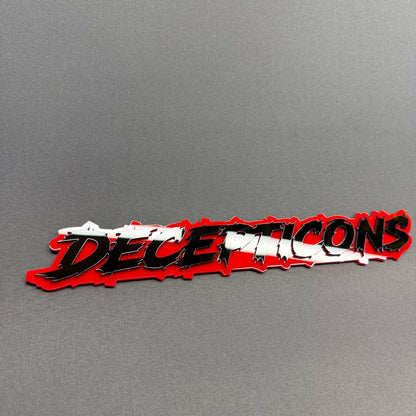 Decepticon Edition red and black double-layer automotive badge with aggressive lettering, aftermarket styling accessory for Dodge Ram 1500 trucks.