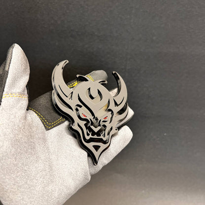 Demon Face exterior vehicle badge with black backing and silver top layer