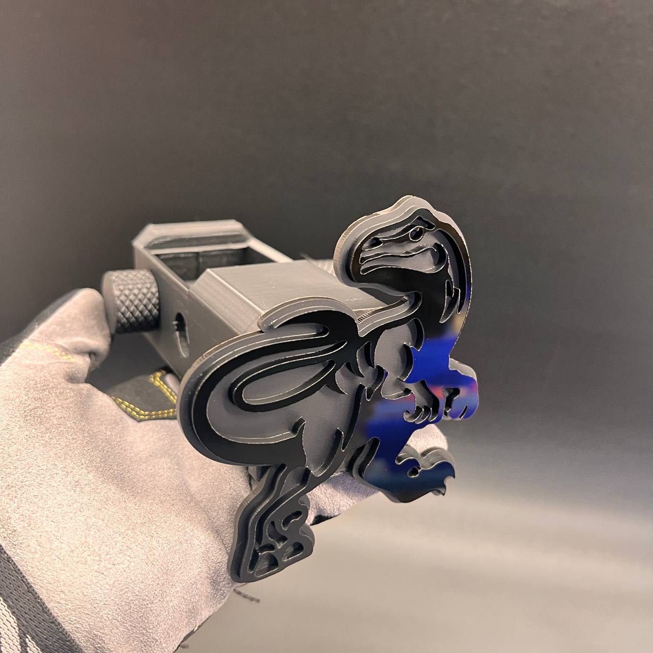 Custom black and silver Raptor hitch cover