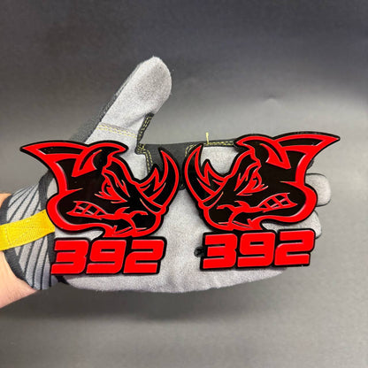 392 Rhino red and black car badge featuring aggressive rhinoceros head design, bold red 392 lettering and layered acrylic construction for Dodge muscle car styling