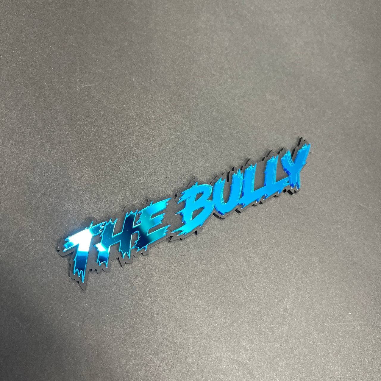 Aggressive custom text emblem in mirror blue acrylic for GMC Sierra