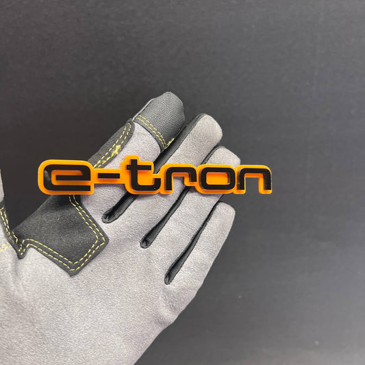 E-TRON car badge fender emblem in orange and black finish
